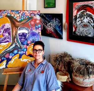 Artist Courtney Hill-Aaron with her painting Ne-Yameng