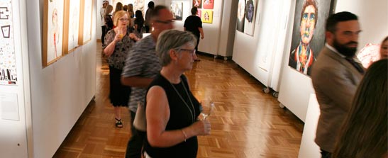 People at gallery viewing art