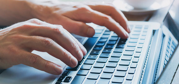 Image of someone using computer keyboard