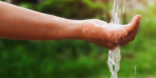 Hand under running tap