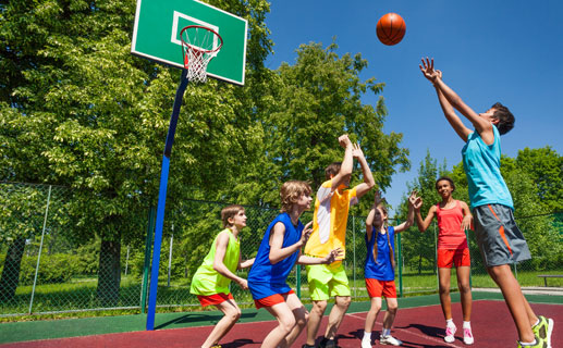 Group of children playing basketball
