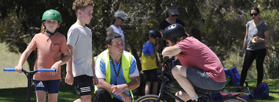 Youth worker with children at BMX park