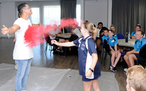 Child throwing dye powder