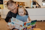 Dad and daughter at library